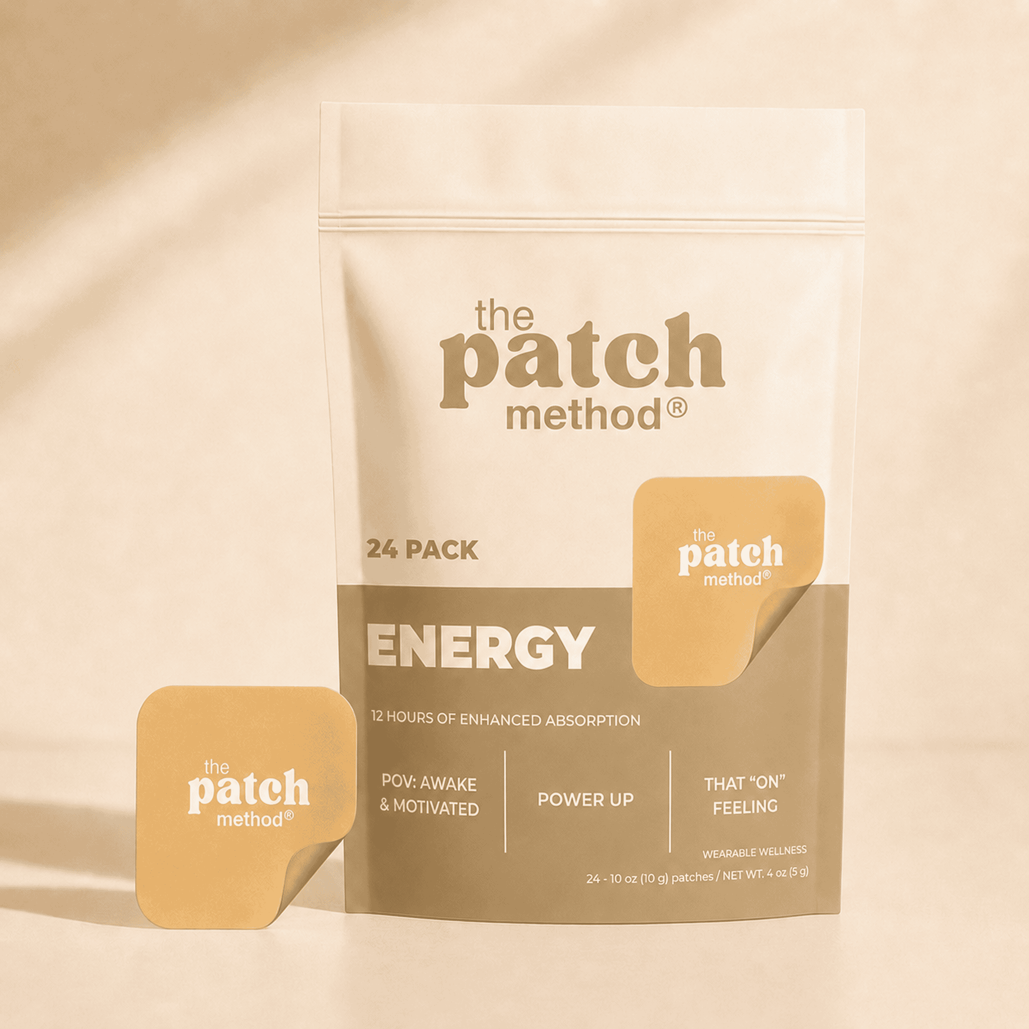 The Patch Method Energy 24-pack pouch with a yellow-orange patch peeling off the front, shown against a warm tan background