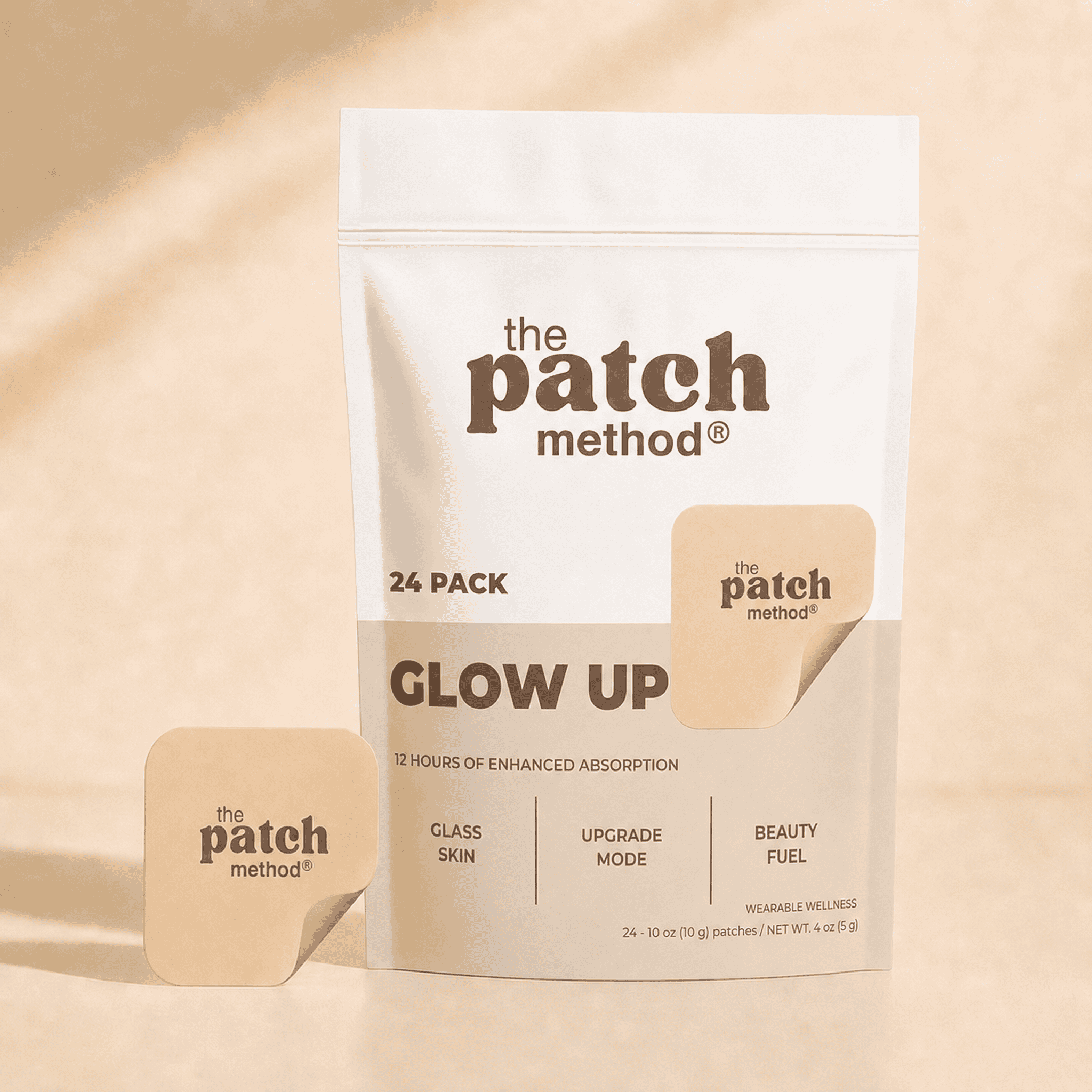 The Patch Method Glow Up 24-pack pouch with a tan patch peeling off the front, shown against a warm tan background