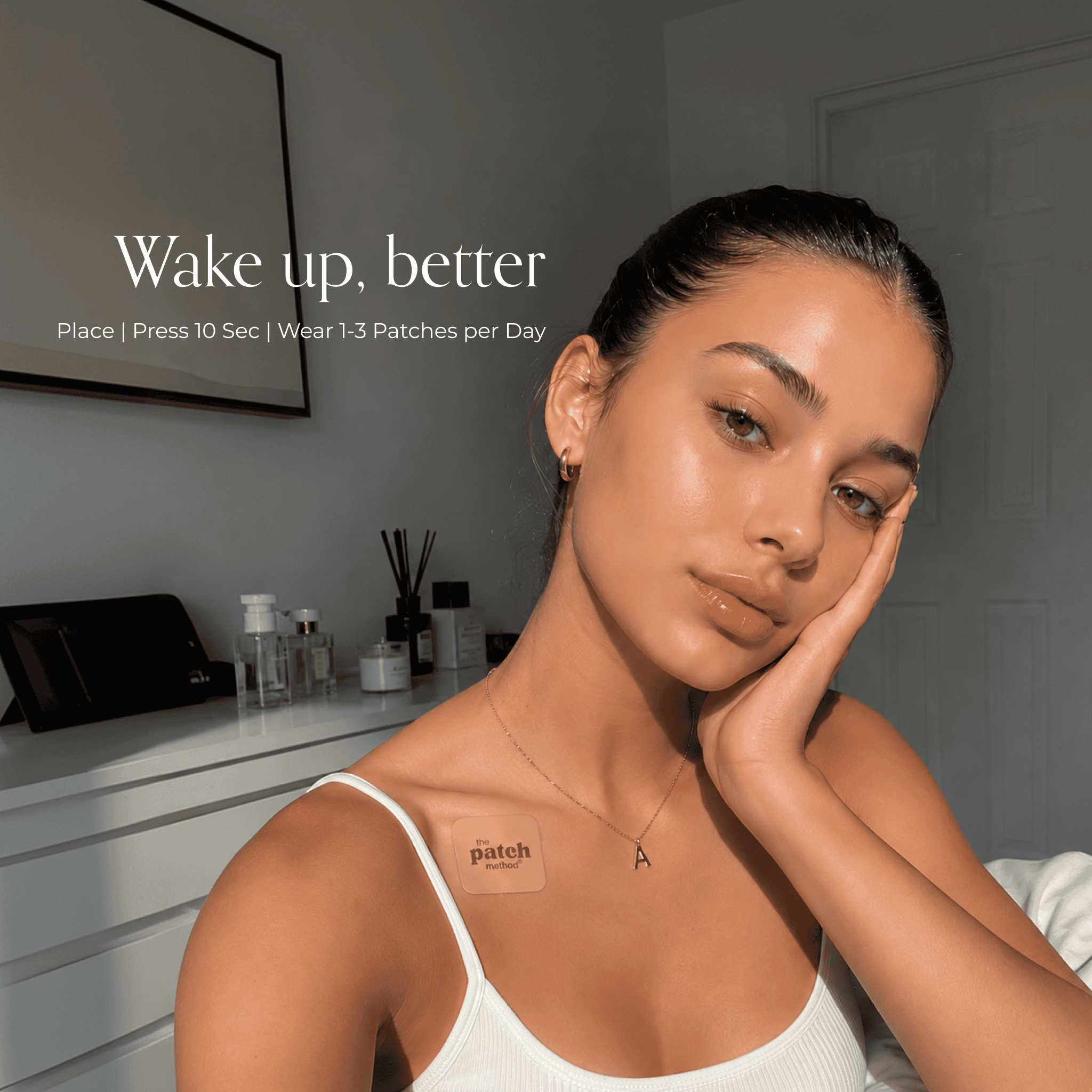 Woman applying or wearing a Glow Up patch in a lifestyle beauty setting