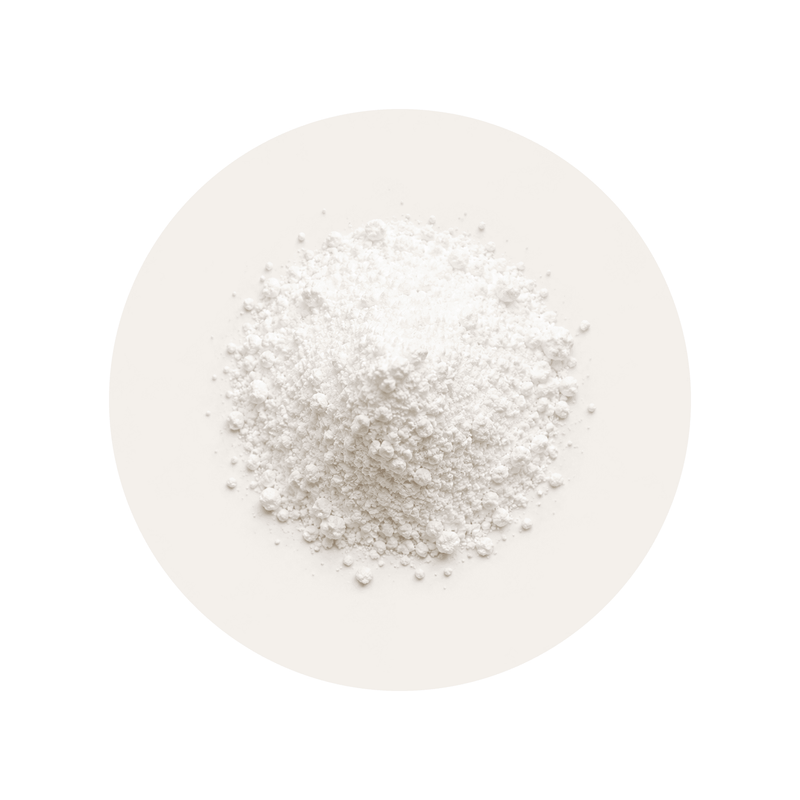 Zinc Glycinate ingredient close-up on a cream circular background