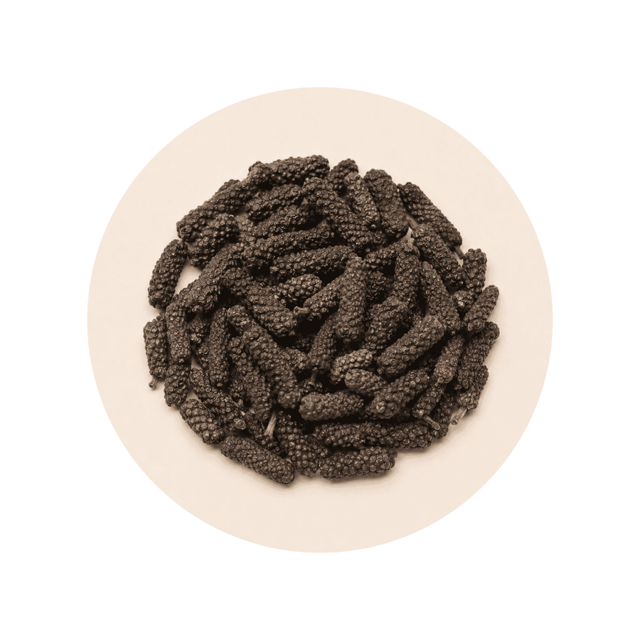 Cosmoperine (black pepper extract) close-up on a cream circular background