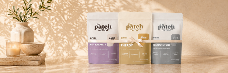 Her Balance, Energy, and Testosterone pouches bundled together with a ribbon bow on a sunlit tan surface with a vase of greenery
