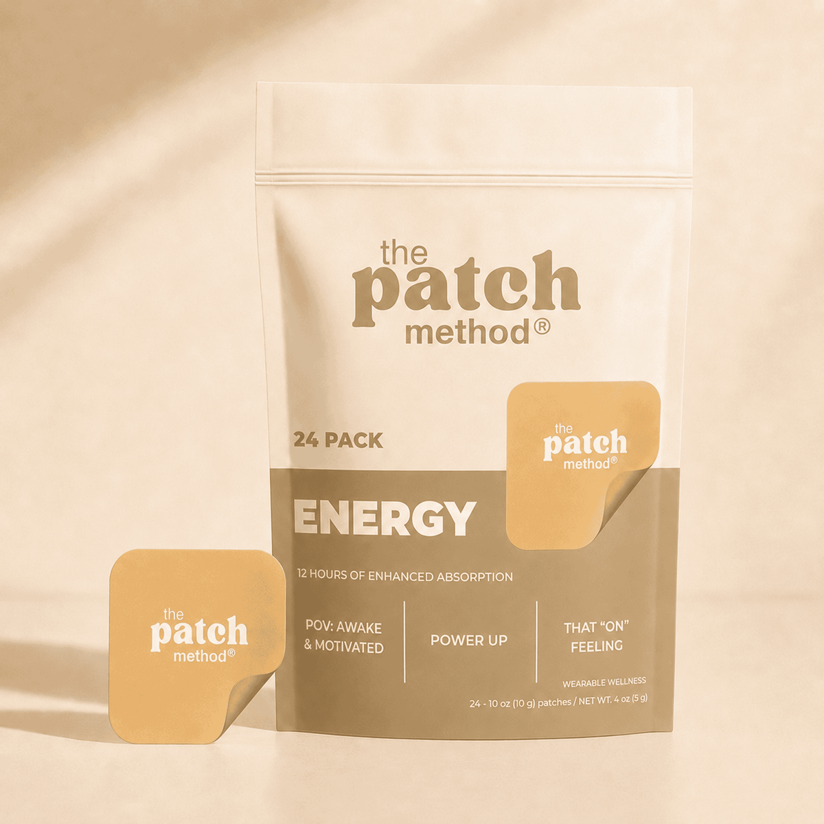 The Patch Method Energy 24-pack pouch with a yellow-orange patch peeling off the front, shown against a warm tan background