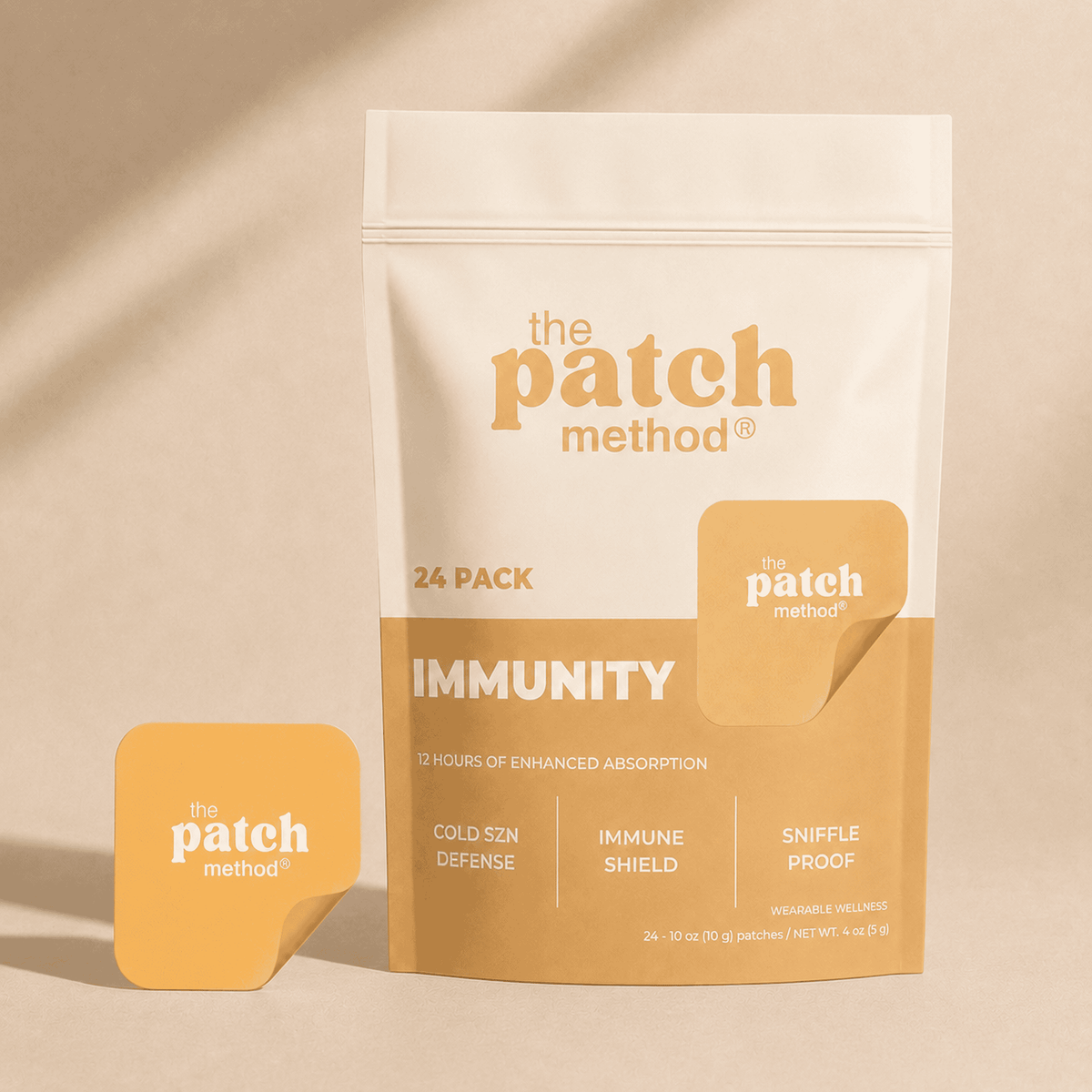 The Patch Method Immunity 24-pack pouch with a golden-yellow patch peeling off the front, labeled Cold SZN Defense, Immune Shield, and Sniffle Proof