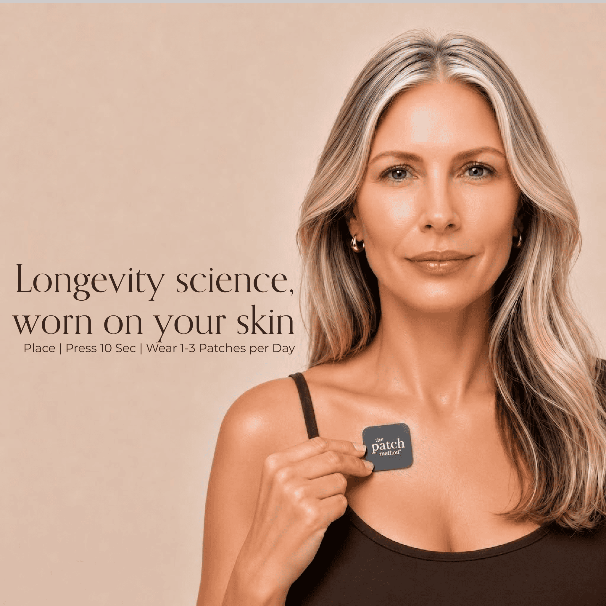 Older woman with gray-blonde hair holding a charcoal Patch Method patch to her chest, next to the text Longevity science, worn on your skin and usage instructions Place, Press 10 Sec, Wear 1-3 Patches per Day