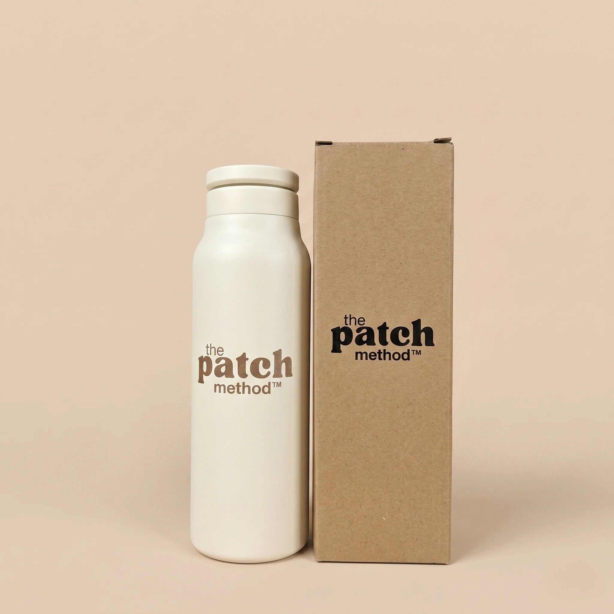 White bottle and brown box with 'the patch method' branding on a beige background