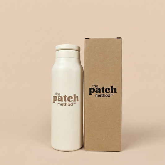 White bottle and brown box with 'the patch method' branding on a beige background