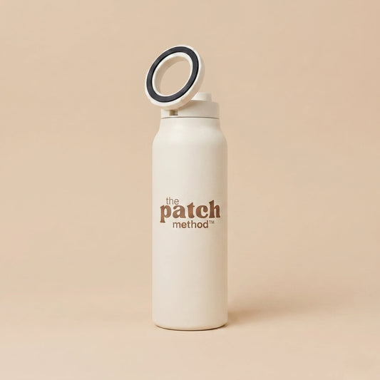 White water bottle with 'the patch method' branding on a beige background